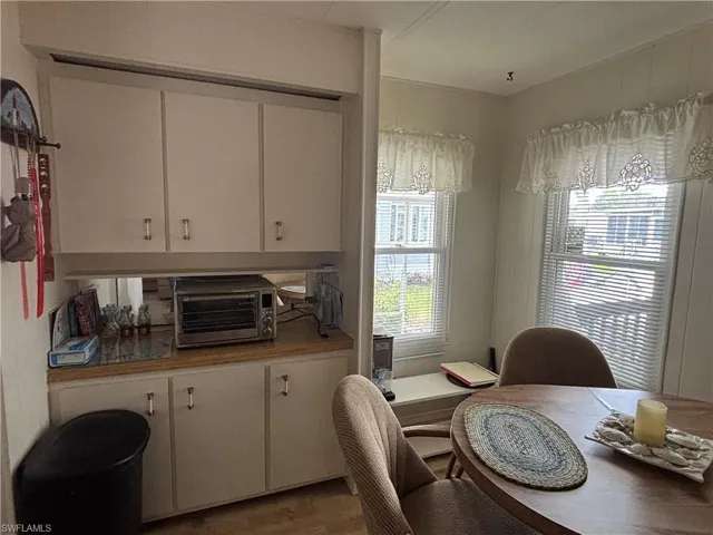 Dining space with a toaster and wood finished floors