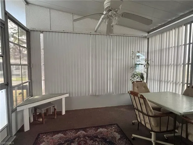 Florida room featuring vaulted ceiling