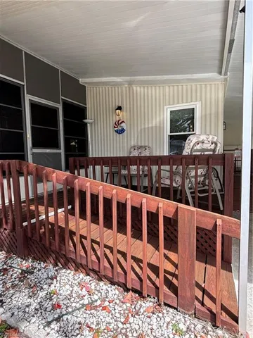 View of wooden ramp entrance to Florida room