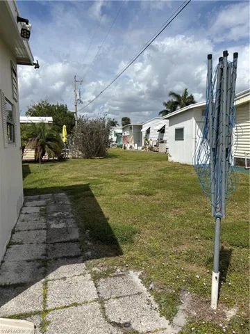 View of yard with clothesline