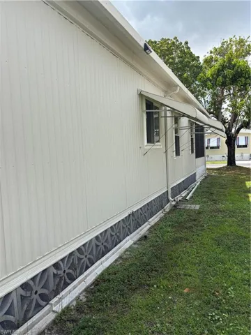 View of home's exterior with a lawn
