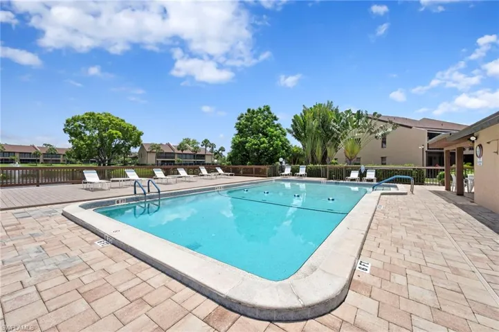 Community pool with a patio area