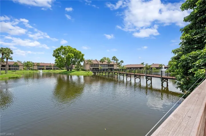 Dock featuring a residential view and a water view