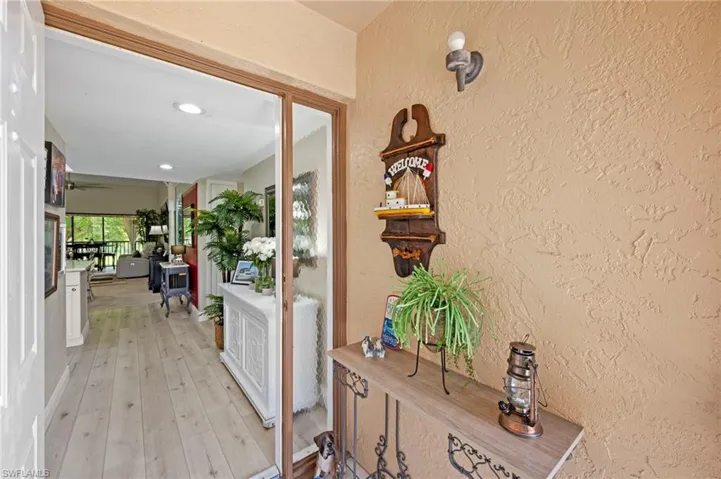 screened entry light wood-style floors, and recessed lighting