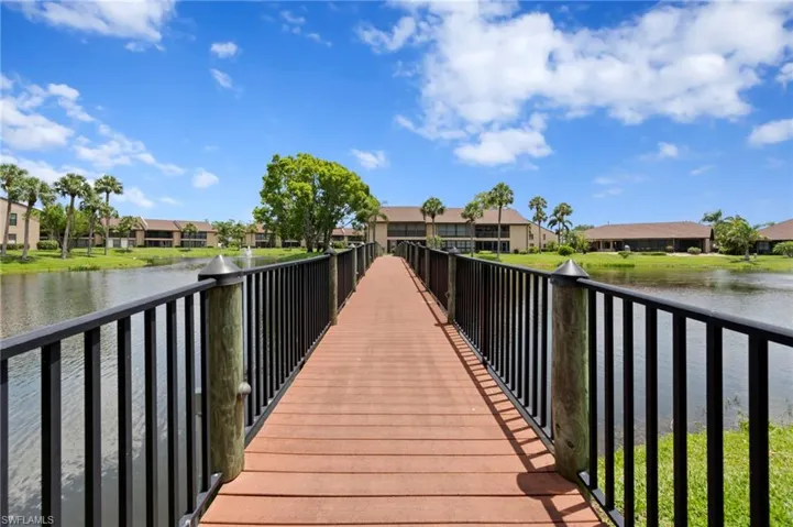 Dock area featuring a residential view and a water view