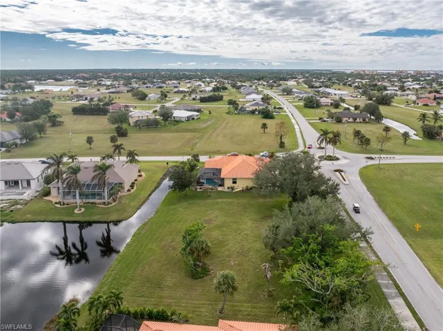 Aerial view with a water view and a residential view