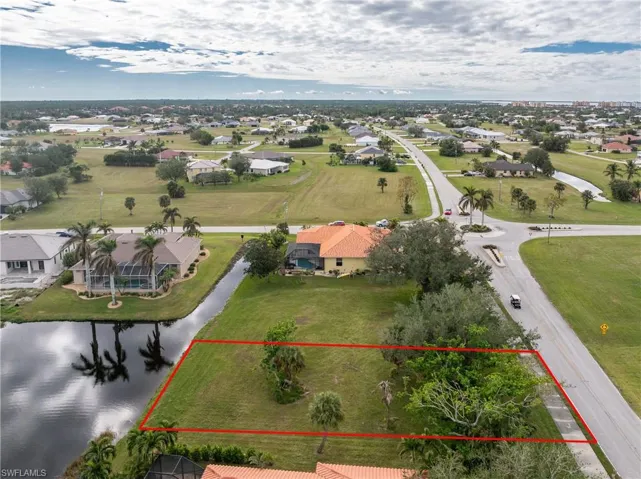 Birds eye view of property featuring a residential view and a water view