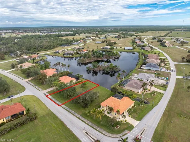 Aerial view with a residential view and a water view