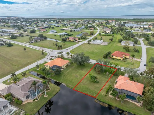 Aerial view featuring a water view and a residential view