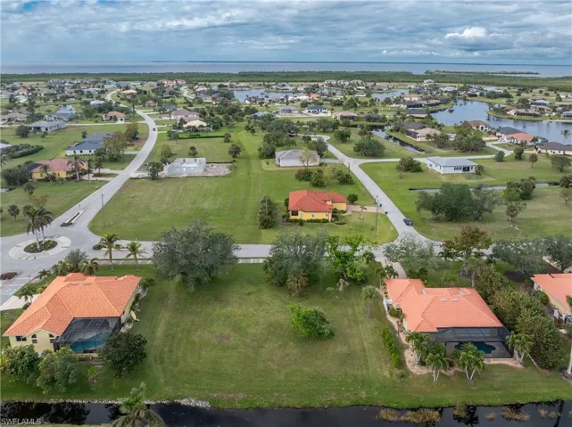 Aerial view with a residential view and a water view