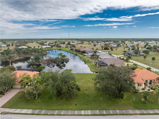 Drone / aerial view with a residential view and a water view