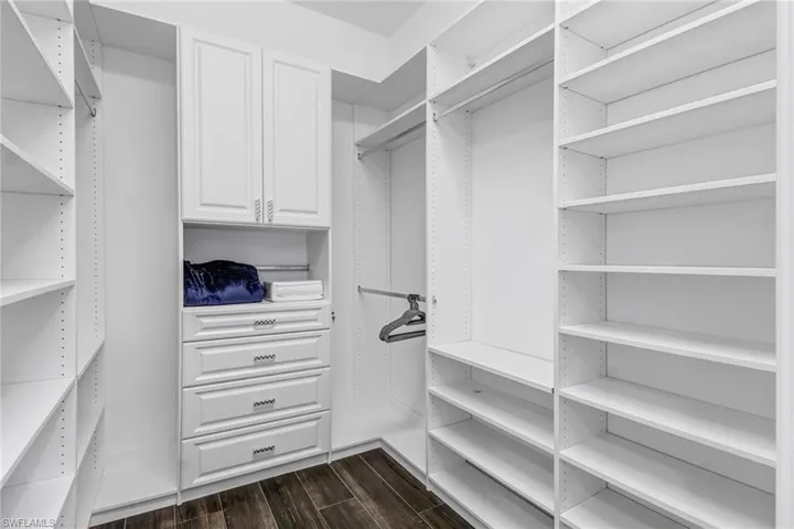 Walk in closet featuring wood tiled floors