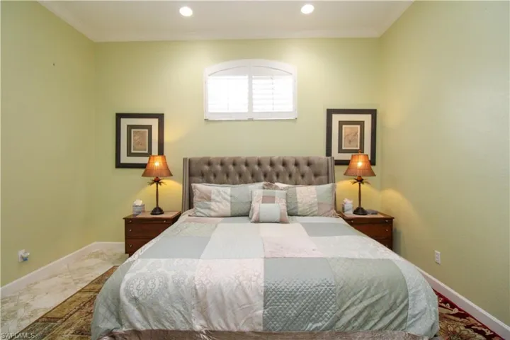 Bedroom featuring crown molding