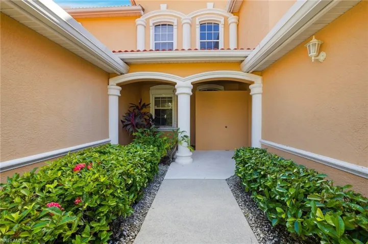 View of exterior entry with stucco siding