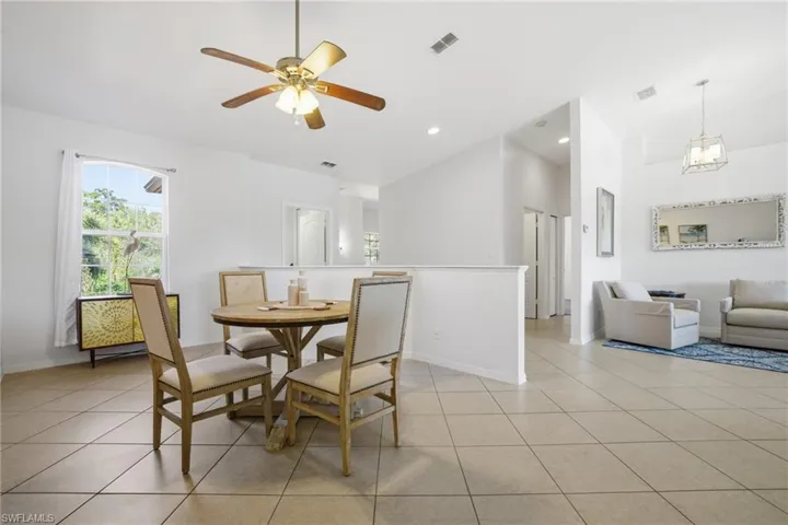 Dining/flex room vaulted ceiling, and lighted ceiling fan