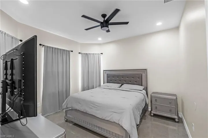 Bedroom featuring recessed lighting and a ceiling fan