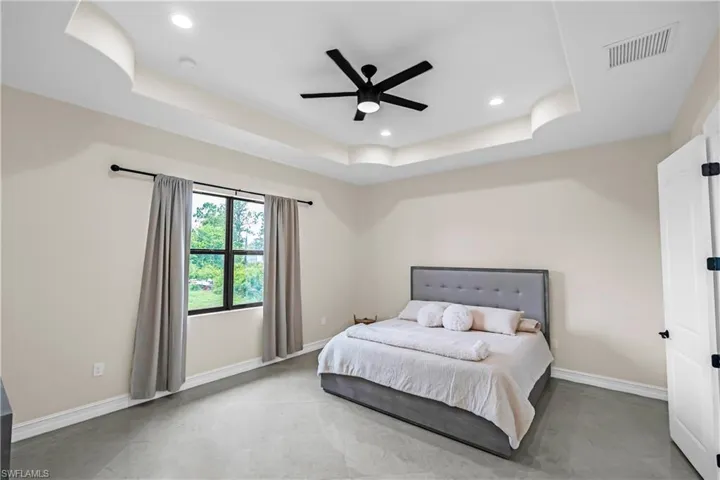 Recessed ceiling with an integrated black ceiling fan and lighting