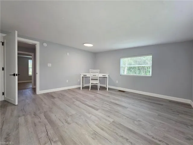 Unfurnished room featuring light wood-type flooring