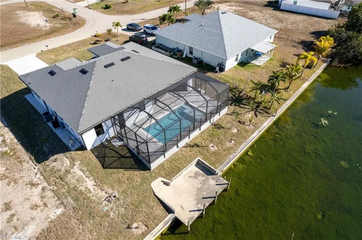 Outdoors, a cantilever concrete dock invites fishing, kayaking, or jet skiing from your own backyard!