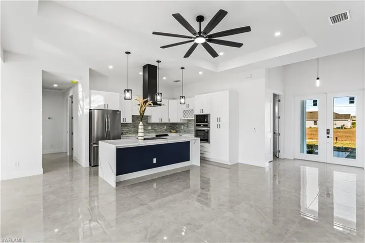 Tile flooring throughout enhances the home with a clean, modern look while offering durability, easy maintenance, and a cool, comfortable feel ideal for Florida living.