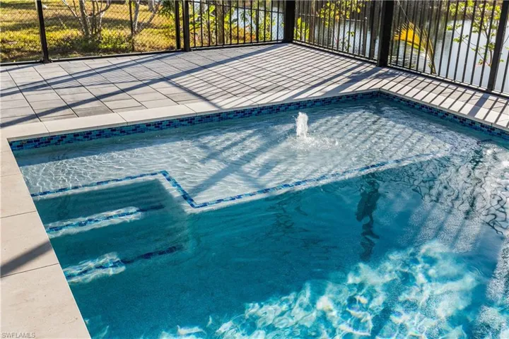 Designed for year-round enjoyment, it offers both relaxation and entertainment in a serene waterfront setting.