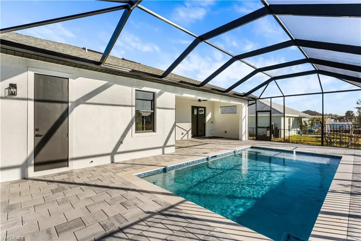 The private screened pool creates a true backyard oasis, ideal for cooling off on warm Florida days or hosting gatherings with family and friends.