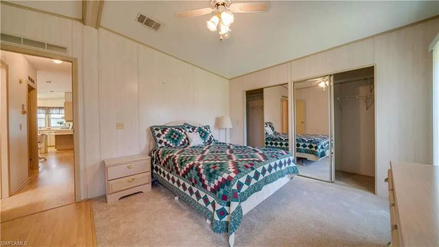 The master bedroom features new carpet and double closets.