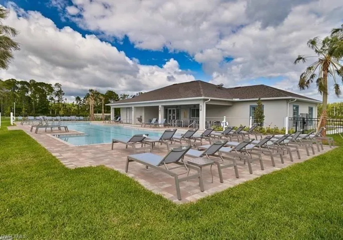 Community pool featuring a patio