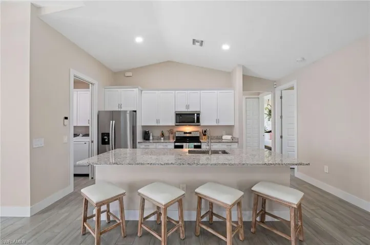 Kitchen with granite counters and stainless steel appliances