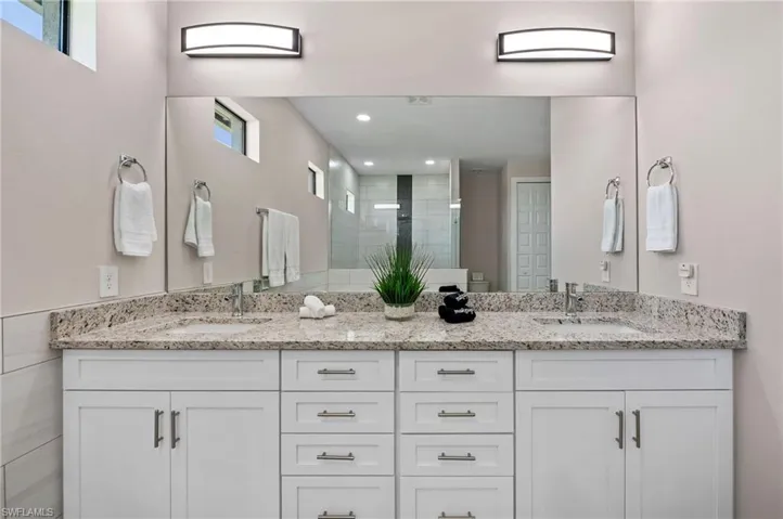 Granite counter tops and dual sinks.