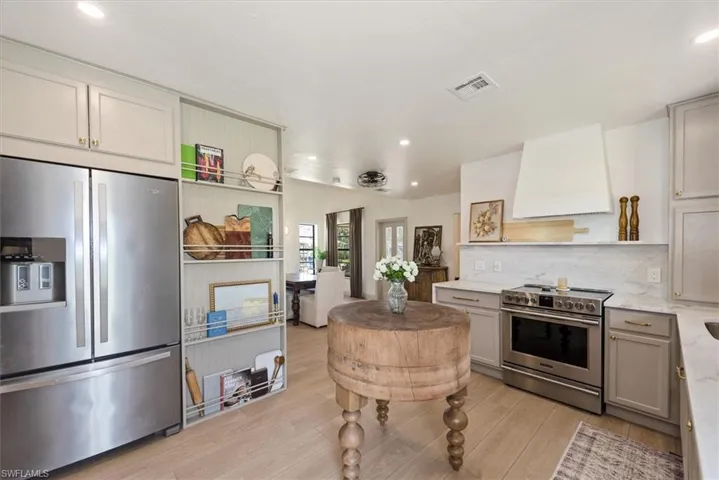 Additional living space featuring recessed lighting, light wood-style floors, and lofted ceiling