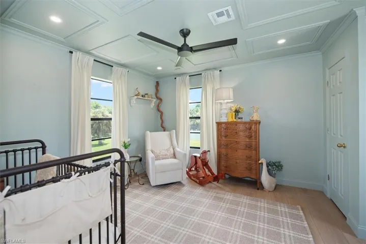 Full bathroom featuring shower / tub combo with curtain, light wood finished floors, vanity, and recessed lighting