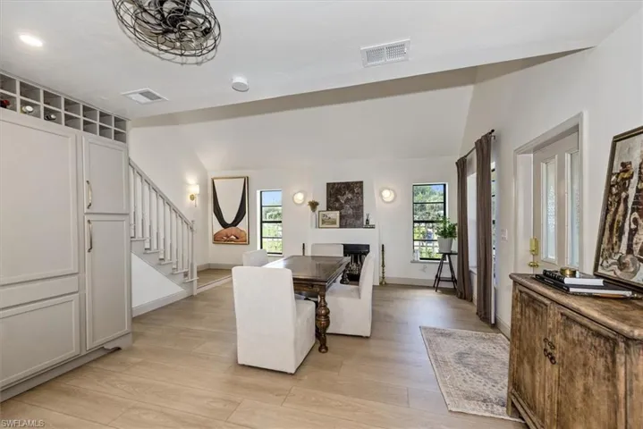 Dining room featuring recessed lighting, stairway, and light wood-style flooring