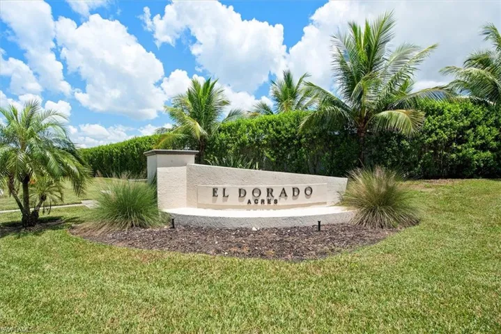 View of property exterior featuring driveway, a yard, and a patio