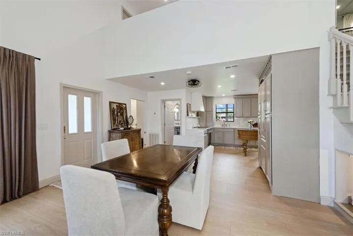 Detailed view of a glass covered fireplace and wood finished floors