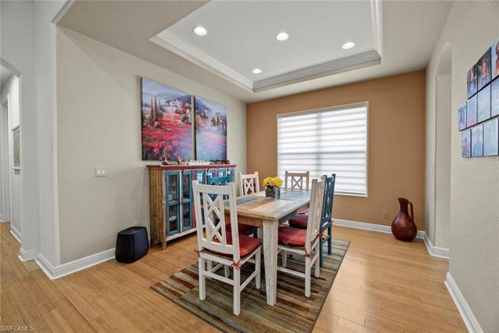 Dining area has tray ceiling, recessed lighting