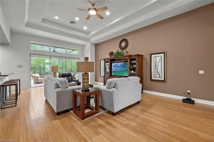 View of great room from hall leading to garage