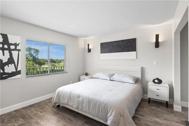 Comfortable and stylish second bedroom, perfect for guests or office space.