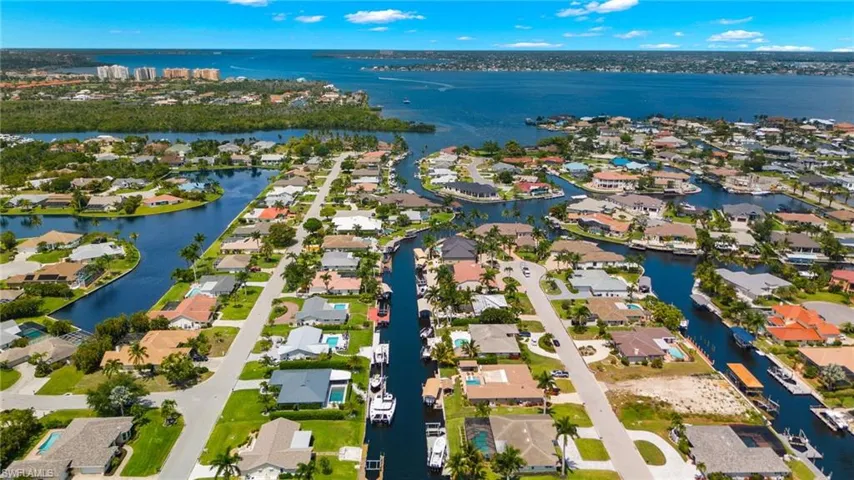 Drone / aerial view featuring a water view and a residential view