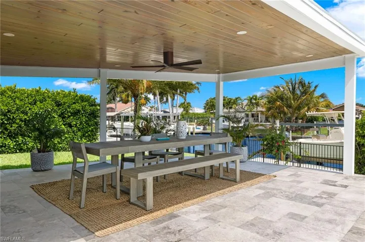 View of patio / terrace featuring outdoor dining area and a ceiling fan