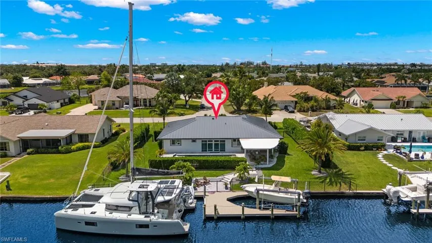 Birds eye view of property with a water view and a residential view
