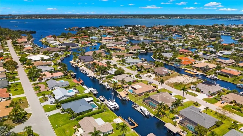 Birds eye view of property featuring a residential view and a water view