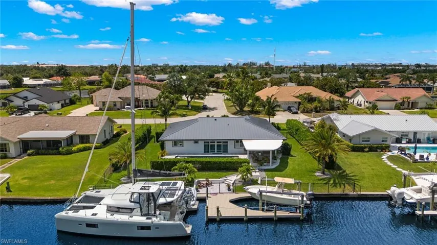 Birds eye view of property featuring a residential view and a water view