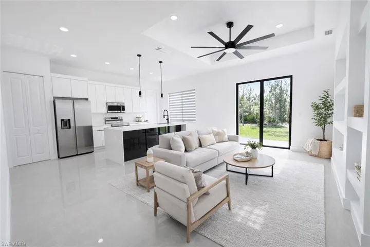 Living area with ceiling fan and recessed lighting
