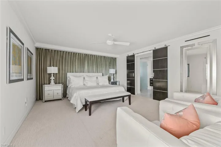 Large primary bedroom with  attached bathroom and walk in closet