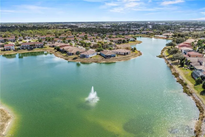 Aerial perspective of suburban area with a large body of water