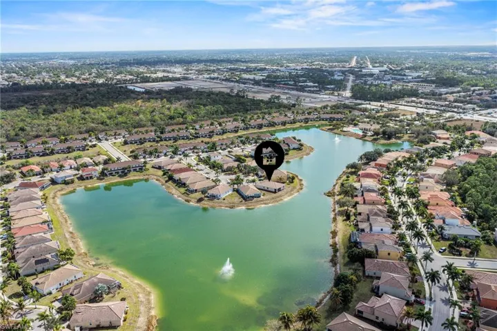 View of property location with a large body of water and nearby suburban area