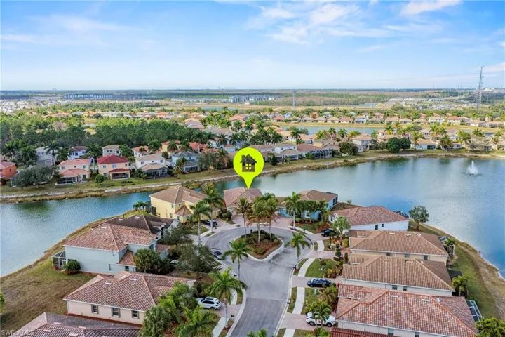 Aerial perspective of suburban area with a large body of water