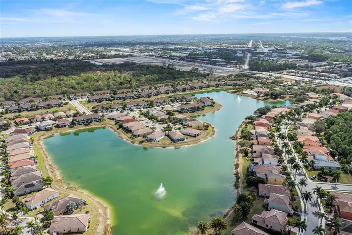 Aerial overview of property's location featuring a large body of water and nearby suburban area