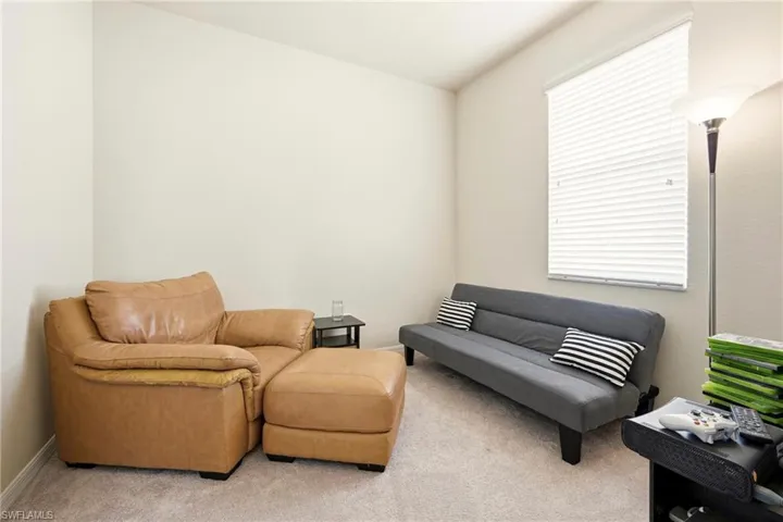 Sitting room with carpet flooring
